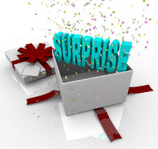 A white gift box springs open to reveal the word Surprise